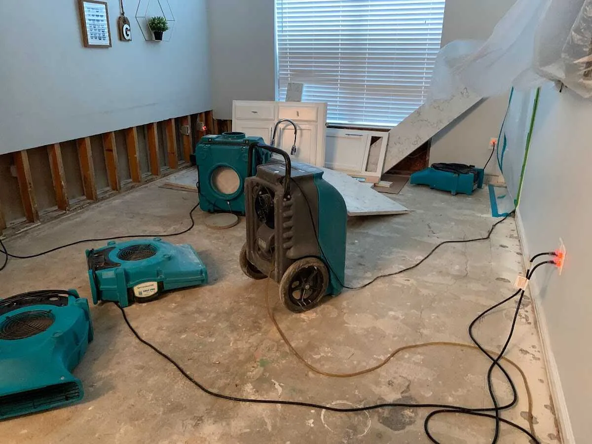 Dehumidifier in flood-cut room for Water Damage Restoration in Red Bank